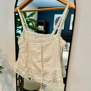 Olivaceous white sleeveless blouse